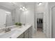 Bright bathroom with double vanity sinks, modern fixtures and walk-in shower at 251 Olde Pl, Zebulon, NC 27597