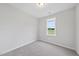 Neutral bedroom with plush carpet and a window with beautiful backyard views at 251 Olde Pl, Zebulon, NC 27597