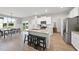 Eat-in kitchen island with granite countertops, stainless appliances, and modern finishes at 251 Olde Pl, Zebulon, NC 27597