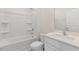 Bright bathroom featuring a shower-tub combo with white tile and a single sink vanity at 281 Hanging Elm Ln, Fuquay Varina, NC 27526