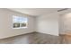 Bright bedroom with a large window offering natural light and a view at 281 Hanging Elm Ln, Fuquay Varina, NC 27526