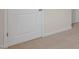 Bedroom features a neutral colored carpet and two white doors at 281 Hanging Elm Ln, Fuquay Varina, NC 27526