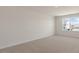 Bedroom with neutral carpeting, a window, and white trim and paint at 281 Hanging Elm Ln, Fuquay Varina, NC 27526