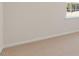 Neutral carpeted bedroom with trim, base molding and a window at 281 Hanging Elm Ln, Fuquay Varina, NC 27526