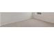 Bedroom with neutral carpet, white walls, and a window for natural light at 281 Hanging Elm Ln, Fuquay Varina, NC 27526
