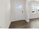 Bright entryway featuring a white door with glass, wood floors, and neutral paint at 281 Hanging Elm Ln, Fuquay Varina, NC 27526