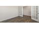 Another view of an bright, versatile room featuring a French doors and wood floors at 281 Hanging Elm Ln, Fuquay Varina, NC 27526