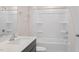 Bathroom includes a single vanity with quartz counters and a tub with tile surround at 292 Perseus St, Angier, NC 27501