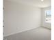 The cozy bedroom features a large window that provides plenty of natural light at 292 Perseus St, Angier, NC 27501