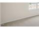 Bedroom with neutral carpet, one window, and light walls ready for personalization at 292 Perseus St, Angier, NC 27501