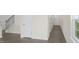 Inviting entryway with modern flooring, neutral walls, and a staircase leading to the upper level at 292 Perseus St, Angier, NC 27501
