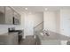Well-equipped kitchen with gray cabinets, stainless steel appliances, and a spacious island at 292 Perseus St, Angier, NC 27501