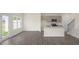 Open-concept kitchen with gray cabinets, stainless steel appliances, and a central island at 292 Perseus St, Angier, NC 27501