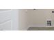 Laundry room with tile floors, washer hookups, and a built in drain on the wall at 292 Perseus St, Angier, NC 27501