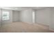Bright bedroom with neutral carpet and a large window providing lots of natural light at 298 Hanging Elm Ln, Fuquay Varina, NC 27526