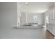 Bright kitchen features granite countertops, white cabinets, and stainless steel sink at 298 Hanging Elm Ln, Fuquay Varina, NC 27526
