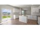 Open-concept kitchen with island, granite countertops, and access to the backyard at 298 Hanging Elm Ln, Fuquay Varina, NC 27526