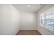 Bright living room featuring wood-look floors, neutral walls, and ample natural light at 298 Hanging Elm Ln, Fuquay Varina, NC 27526