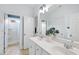Bright bathroom featuring a double vanity, with access to a shower and toilet room at 310 Millsfield Drive Dr, Cary, NC 27519