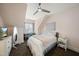 Bedroom featuring a fan, desk, TV, mirror and light neutral decor at 310 Millsfield Drive Dr, Cary, NC 27519