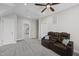 Room with ceiling fan, carpet and a comfortable-looking recliner loveseat with cupholders at 310 Millsfield Drive Dr, Cary, NC 27519