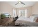 Bright bedroom with a desk area, television, and comfortable furnishings at 310 Millsfield Drive Dr, Cary, NC 27519
