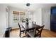 Cozy dining area with a wooden table, four chairs, and a pendant light fixture at 310 Millsfield Drive Dr, Cary, NC 27519