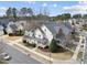Charming two-story home featuring a covered front porch, attractive landscaping, and a lush lawn at 310 Millsfield Drive Dr, Cary, NC 27519