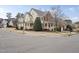 Beautiful multi-story home featuring a welcoming front porch on a corner lot at 310 Millsfield Drive Dr, Cary, NC 27519