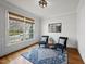 Cozy living room with hardwood floors, a large window, and neutral decor at 310 Millsfield Drive Dr, Cary, NC 27519