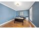 Stylish office space with blue walls, hardwood floors, and ample natural light at 310 Millsfield Drive Dr, Cary, NC 27519