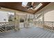 Relaxing screened-in porch features a ceiling fan and view of the backyard at 310 Millsfield Drive Dr, Cary, NC 27519