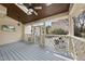 Relaxing screened-in porch with television, fan, and backyard view at 310 Millsfield Drive Dr, Cary, NC 27519