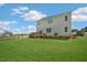 Spacious backyard with a well-maintained lawn and a wooden deck, perfect for outdoor enjoyment at 311 Hanging Elm Ln, Fuquay Varina, NC 27526