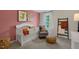 Cozy Bedroom with crib, glider chair, and unique decor for a comforting space at 311 Hanging Elm Ln, Fuquay Varina, NC 27526