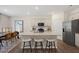 Spacious kitchen with granite counters, stainless steel appliances and a large center island with seating at 311 Hanging Elm Ln, Fuquay Varina, NC 27526