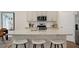 Bright open kitchen with large island, granite counters, stainless appliances and ample counter space at 311 Hanging Elm Ln, Fuquay Varina, NC 27526