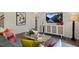 Comfortable living room with stylish decor, modern furniture, and an open view to the hallway and staircase at 311 Hanging Elm Ln, Fuquay Varina, NC 27526