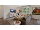 Cozy living room featuring stylish decor, a comfortable sofa, and large window offering ample natural light at 311 Hanging Elm Ln, Fuquay Varina, NC 27526