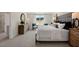 Bright main bedroom featuring a stylish bed, dresser, and a bright view to the exterior at 311 Hanging Elm Ln, Fuquay Varina, NC 27526