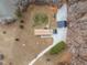 Aerial view of property showcasing the lake, home, new shop, storage shed, and spacious yard at 341 Acorn Ct, Rougemont, NC 27572