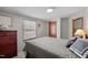 Comfortable bedroom with natural light and a dresser with dark wooden accents at 341 Acorn Ct, Rougemont, NC 27572