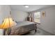 Bright bedroom featuring a comfortable bed, dresser, and a sunlit window at 341 Acorn Ct, Rougemont, NC 27572