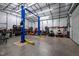 Garage interior with two post lift at 341 Acorn Ct, Rougemont, NC 27572