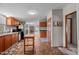 Open kitchen layout with views of the dining area and living room, equipped with stainless steel appliances at 341 Acorn Ct, Rougemont, NC 27572