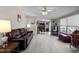 Spacious living room with plush carpeting, a ceiling fan, and connecting dining and kitchen areas at 341 Acorn Ct, Rougemont, NC 27572