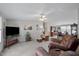 Bright and spacious living room featuring plush seating, ceiling fan and an open layout concept at 341 Acorn Ct, Rougemont, NC 27572