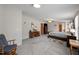 Large primary bedroom boasts cozy carpet, a ceiling fan, and lots of natural light at 341 Acorn Ct, Rougemont, NC 27572