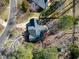 An aerial shot reveals a home with mature trees and meticulously kept grounds in a tranquil neighborhood at 3510 Middlebrook Dr, Durham, NC 27705