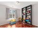 bedroom featuring wood floors, neutral paint and a book shelf full of toys at 3510 Middlebrook Dr, Durham, NC 27705